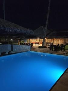 a blue lighted swimming pool at night at CUMBUCO - Eco Paradise - AP 112 in Caucaia