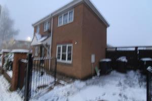 a house with a fence in the snow at Stirling House in Sheffield