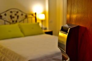 Cama ou camas em um quarto em Hotel Asturias