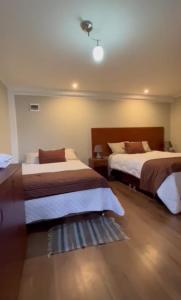 Een bed of bedden in een kamer bij Hotel Vista Verde