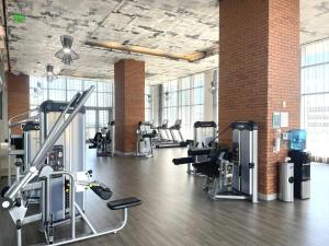 a gym with rows of treadmills and cardio machines at Hyde Beach House Lux Apartment in Hollywood
