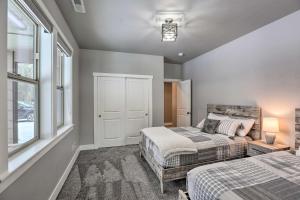 a bedroom with two beds and a window at Northwest Sunriver Getaway with Community Amenities! in Sunriver
