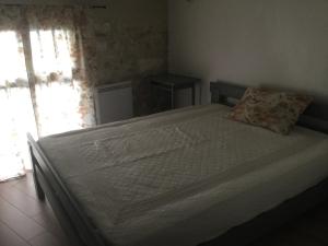 Posteľ alebo postele v izbe v ubytovaní Petite maison sur jardin secret