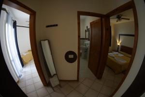 Postel nebo postele na pokoji v ubytování Estoril Hotel - Apartments