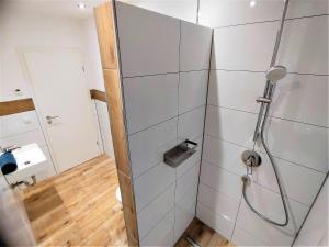 a shower stall in a bathroom with a shower at Landhaus am Schindelberglift in Oberstaufen +114 photos