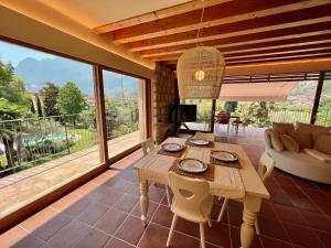 a living room with a table and a couch at Da Gianni e Villa Annamaria in Arco