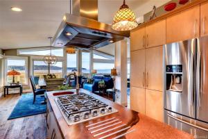 a kitchen with a stove top oven in a room at Oasis By The Sea in Port Hadlock