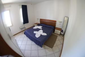Postel nebo postele na pokoji v ubytování Estoril Hotel - Apartments