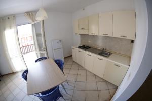 Kuchyň nebo kuchyňský kout v ubytování Estoril Hotel - Apartments