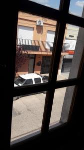 a view of a car through a window at Alojamiento Guemes in Gualeguay