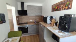 a kitchen with a counter top with a microwave at Fewo Gabriela Allgäu in Immenstadt im Allgäu