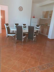 a dining room with a table and chairs at APARTAMENT BELUX in Eforie Sud