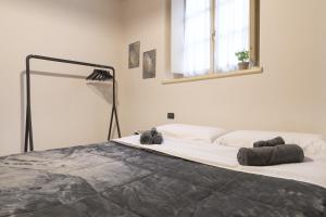 Postel nebo postele na pokoji v ubytování Grazioso appartamento in centro storico Chiari