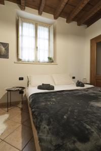Postel nebo postele na pokoji v ubytování Grazioso appartamento in centro storico Chiari