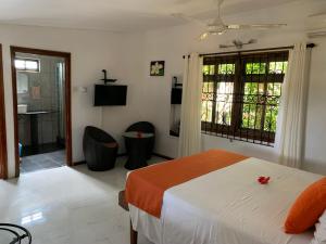 Voodi või voodid majutusasutuse Amitie Chalets Praslin toas