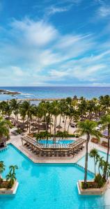 an aerial view of a resort with palm trees and the ocean at Dreams Aventuras Riviera Maya - All Inclusive in Puerto Aventuras