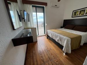 Postel nebo postele na pokoji v ubytování Gran Colonial Riviera