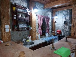 a kitchen with a sink and a counter top at Kuća za odmor Grujić in Kolašin