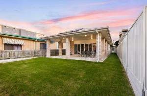 an image of a house with a yard at Redcliffe in Redcliffe