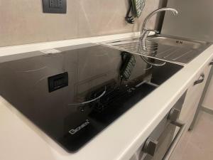 Kuchyňa alebo kuchynka v ubytovaní HappyHome Bilocale centro storico Rivarolo Canavese