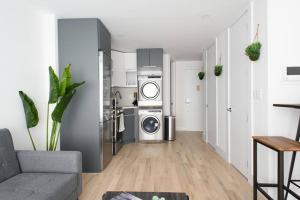 a kitchen with a washer and dryer in a living room at 75-1D New 1BR prime UES W D the unit Best Value in New York