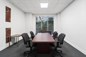 a conference room with a table and chairs at Hollywood Beach Ocean View Condo, Direct Beach Access, Pool & Resort Amenities in Hollywood +33 photos