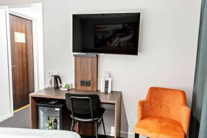 TV o dispositivi per l'intrattenimento presso Best Western Hotel Corallen