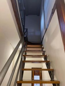 a staircase in a building with wooden steps at Vistas desde la Plata in Toledo