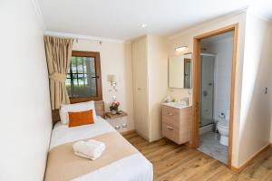 Postel nebo postele na pokoji v ubytování Tagle Hotel Boutique