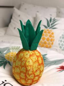 a pineapple sitting on top of a bed at Shinjuku Y HOTEL in Tokyo