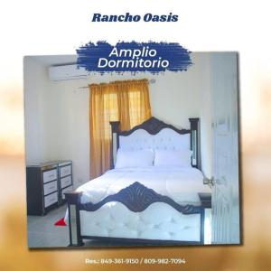 a framed picture of a bedroom with a bed at Rancho Oasis, Residencial Sanate in Higuey
