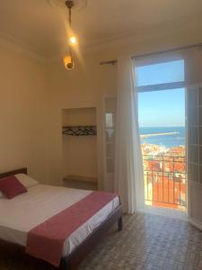 Postel nebo postele na pokoji v ubytování AFRIC HOTEL- Casbah