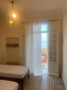 Postel nebo postele na pokoji v ubytování AFRIC HOTEL- Casbah