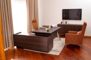 TV o dispositivi per l'intrattenimento presso Pier Harbour Residences and Spa