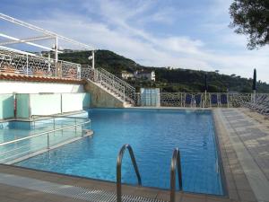 a large swimming pool with stairs on top of a building at Hotel Dania in Sorrento
