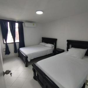 A bed or beds in a room at Apartamento con salida al mar