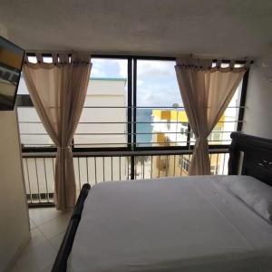 Cama o camas de una habitación en Apartamento con salida al mar