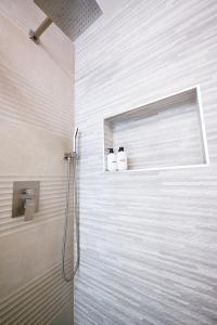 two toilets sitting on a shelf in a bathroom at @ Marbella Lane - Exquisite Home 3BR in Sunnyvale +53 photos