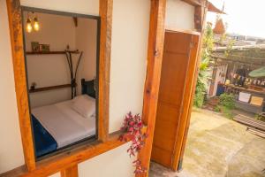 Postel nebo postele na pokoji v ubytování Kimaná Hostal