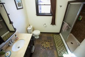 a bathroom with a sink and a shower and a toilet at Climb On Inn - Red River Gorge Kentucky - Amazing Home ! 