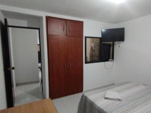 Televisyen dan/atau pusat hiburan di El Hogar de Ami