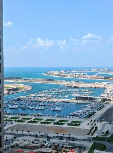 an aerial view of a marina with boats in the water at Sea View 1BR apartment - Marina Pinnacle in Dubai