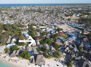 an aerial view of a beach with houses at Siri Beach Lodge in Nungwi