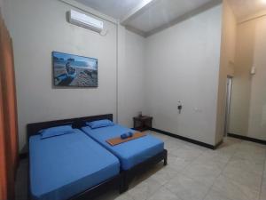 Posteľ alebo postele v izbe v ubytovaní Bintang Homestay Watukarung