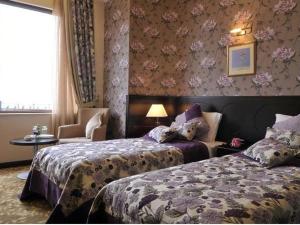 Postel nebo postele na pokoji v ubytování Riviera Hotel + 37 fotografií
