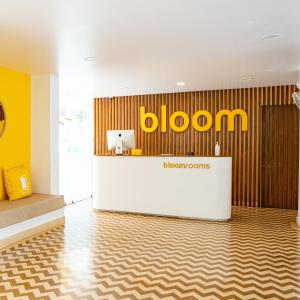 a lobby with a yellowazon sign on a wall at Bloomrooms Calangute in Calangute