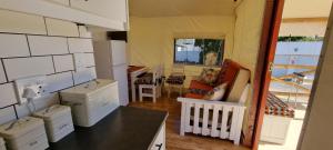 a kitchen with white cabinets and a counter top at Zonnevanger Guesthouse in Noorder-Paarl