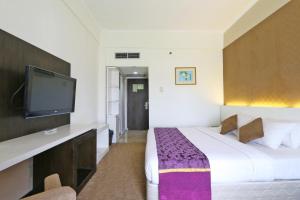 Letto o letti in una camera di Hotel Kaisar