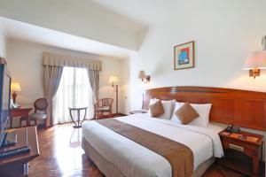 Letto o letti in una camera di Hotel Kaisar