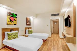 Katil atau katil-katil dalam bilik di Lemon Tree Hotel, Ahmedabad